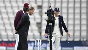 England captain Ben Stokes, right, and West Indies' captain Jason Holder, left, watch the coin before Stoke won the toss on the first day of the 1st cricket Test match between England and West Indies, at the Ageas Bowl in Southampton, England, Wednesday July 8, 2020.(AP) England captain Ben Stokes, right, and West Indies' captain Jason Holder, left, watch the coin before Stoke won the toss on the first day of the 1st cricket Test match between England and West Indies, at the Ageas Bowl in Southampton, England, Wednesday July 8, 2020.(AP)