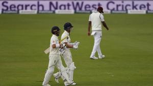 England's Rory Burns, left, and Joe Denly leave the field at tea during the first day of the 1st cricket Test match between England and West Indies, at the Ageas Bowl in Southampton, England, Wednesday July 8, 2020.(AP) England's Rory Burns, left, and Joe Denly leave the field at tea during the first day of the 1st cricket Test match between England and West Indies, at the Ageas Bowl in Southampton, England, Wednesday July 8, 2020.(AP)