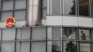 An official looks out after an opening ceremony for the China's new Office for Safeguarding National Security in Hong Kong.(AP) An official looks out after an opening ceremony for the China's new Office for Safeguarding National Security in Hong Kong.(AP)