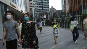 People wearing face masks are seen at the Sanlitun shopping area, following the outbreak of the coronavirus disease (COVID-19), in Beijing, China July 1, 2020. (Representational photo)(REUTERS) People wearing face masks are seen at the Sanlitun shopping area, following the outbreak of the coronavirus disease (COVID-19), in Beijing, China July 1, 2020. (Representational photo)(REUTERS)