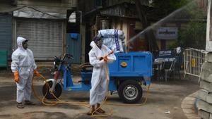 Kolkata Municipal Corporation (KMC) workers wearing PPE coveralls chemically disinfect the Telenga Bagan area in Ultadanga -- one of the new coronavirus containment zone in Kolkata, West Bengal, India, on Thursday, July 09, 2020.(Photo by Samir Jana / Hindustan Times) Kolkata Municipal Corporation (KMC) workers wearing PPE coveralls chemically disinfect the Telenga Bagan area in Ultadanga -- one of the new coronavirus containment zone in Kolkata, West Bengal, India, on Thursday, July 09, 2020.(Photo by Samir Jana / Hindustan Times)