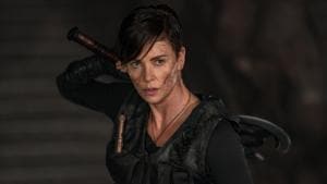 The Old Guard movie review: Charlize Theron stars as an immortal mercenary in new Netflix film.(Aimee Spinks/NETFLIX) The Old Guard movie review: Charlize Theron stars as an immortal mercenary in new Netflix film.(Aimee Spinks/NETFLIX)