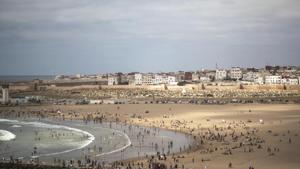 In this Friday, June 26, 2020 file photo, people gather at a reopened beach on the first weekend after lockdown measures were lifted in Sale, Morocco.(AP Photo/Mosa'ab Elshamy, File) In this Friday, June 26, 2020 file photo, people gather at a reopened beach on the first weekend after lockdown measures were lifted in Sale, Morocco.(AP Photo/Mosa'ab Elshamy, File)