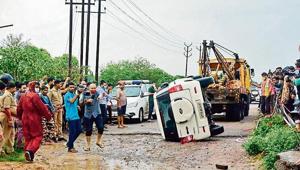 The overturned vehicle that cops say was carrying the gangster towed away near Kanpur on Friday. The overturned vehicle that cops say was carrying the gangster towed away near Kanpur on Friday.