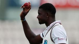 West Indies' Jason Holder celebrates with the ball after England's first innings.(REUTERS) West Indies' Jason Holder celebrates with the ball after England's first innings.(REUTERS)