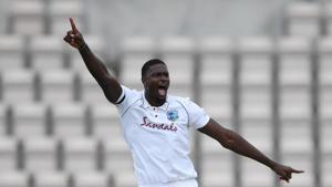 West Indies' Jason Holder celebrates taking the wicket of England's Ben Stokes, as play resumes behind closed doors following the outbreak of the coronavirus disease(REUTERS) West Indies' Jason Holder celebrates taking the wicket of England's Ben Stokes, as play resumes behind closed doors following the outbreak of the coronavirus disease(REUTERS)