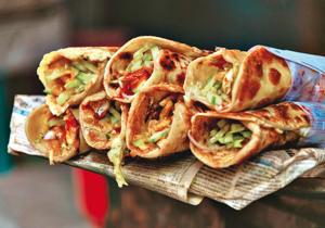 Kebabs rolled in paratha with onions is a fantastic dish that needs to be popularised and preserved(Shutterstock) Kebabs rolled in paratha with onions is a fantastic dish that needs to be popularised and preserved(Shutterstock)