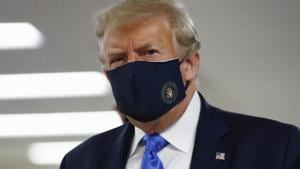President Donald Trump wears a face mask as he walks down a hallway during a visit to Walter Reed National Military Medical Center in Bethesda, Md., Saturday, July 11, 2020.(AP photo) President Donald Trump wears a face mask as he walks down a hallway during a visit to Walter Reed National Military Medical Center in Bethesda, Md., Saturday, July 11, 2020.(AP photo)
