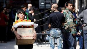 A boy holds a cardboard box of food aid received from World Food Programme in Aleppo's Kalasa district, Syria.(REUTERS/For Representative Purposes Only) A boy holds a cardboard box of food aid received from World Food Programme in Aleppo's Kalasa district, Syria.(REUTERS/For Representative Purposes Only)