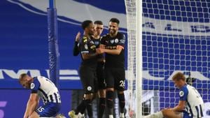 Soccer Football - Premier League - Brighton & Hove Albion v Manchester City - The American Express Community Stadium, Brighton, Britain - July 11, 2020 Manchester City's Raheem Sterling celebrates scoring their fifth goal and completing his hat-trick with teammates, as play resumes behind closed doors following the outbreak of the coronavirus disease (COVID-19) Pool via REUTERS/Catherine Ivill EDITORIAL USE ONLY. No use with unauthorized audio, video, data, fixture lists, club/league logos or 'live' services. Online in-match use limited to 75 images, no video emulation. No use in betting, games or single club/league/player publications. Please contact your account representative for further details.(Pool via REUTERS) Soccer Football - Premier League - Brighton & Hove Albion v Manchester City - The American Express Community Stadium, Brighton, Britain - July 11, 2020 Manchester City's Raheem Sterling celebrates scoring their fifth goal and completing his hat-trick with teammates, as play resumes behind closed doors following the outbreak of the coronavirus disease (COVID-19) Pool via REUTERS/Catherine Ivill EDITORIAL USE ONLY. No use with unauthorized audio, video, data, fixture lists, club/league logos or 'live' services. Online in-match use limited to 75 images, no video emulation. No use in betting, games or single club/league/player publications. Please contact your account representative for further details.(Pool via REUTERS)