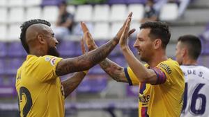 Barcelona's Arturo Vidal, left, celebrates with his teammate Lionel Messi after scoring his side's first goal during the Spanish La Liga soccer match between Valladolid and FC Barcelona at the Jose Zorrilla stadium in Valladolid, Spain, Saturday, July 11, 2020. (AP Photo/Manu Fernandez)(AP) Barcelona's Arturo Vidal, left, celebrates with his teammate Lionel Messi after scoring his side's first goal during the Spanish La Liga soccer match between Valladolid and FC Barcelona at the Jose Zorrilla stadium in Valladolid, Spain, Saturday, July 11, 2020. (AP Photo/Manu Fernandez)(AP)