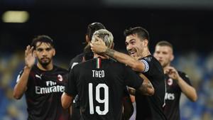 AC Milan's Theo Hernandez (10) is congratulated after a goal against Napoli during a Serie A soccer match at San Paolo Stadium in Naples, Italy, Sunday, July 12, 2020. (Spada/LaPresse via AP)(AP)