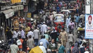 Pedestrians and vehicles jostle for space in a crowded street leading to no social distancing at Jama Masjid market in New Delhi on Wednesday.(Biplov Bhuyan/HT Photo) Pedestrians and vehicles jostle for space in a crowded street leading to no social distancing at Jama Masjid market in New Delhi on Wednesday.(Biplov Bhuyan/HT Photo)
