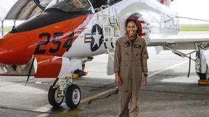 Kingsville: In this photo provided by the U.S. Navy, student Naval aviator Lt. j.g. Madeline Swegle, assigned to the Redhawks of Training Squadron (VT) 21 at Naval Air Station Kingsville, Texas, stands by a T-45C Goshawk training aircraft.(AP Photo) Kingsville: In this photo provided by the U.S. Navy, student Naval aviator Lt. j.g. Madeline Swegle, assigned to the Redhawks of Training Squadron (VT) 21 at Naval Air Station Kingsville, Texas, stands by a T-45C Goshawk training aircraft.(AP Photo)
