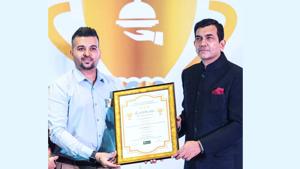 Vikas Solanki receiving “India’s Most Prominent Food and Hospitality Award, 2019” from Chef Sanjeev Kapoor. Vikas Solanki receiving “India’s Most Prominent Food and Hospitality Award, 2019” from Chef Sanjeev Kapoor.