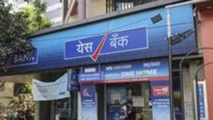 A security guard wearing a protective mask stands outside a Yes Bank Ltd. branch on a near-empty street in Mumbai, India.(Bloomberg file photo) A security guard wearing a protective mask stands outside a Yes Bank Ltd. branch on a near-empty street in Mumbai, India.(Bloomberg file photo)