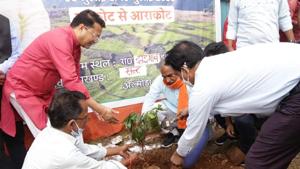 Uttarakhand education minister Arvind Pandey planting a tree in Almora district as part of plantation drive ahead of Harela festival.(HT photo) Uttarakhand education minister Arvind Pandey planting a tree in Almora district as part of plantation drive ahead of Harela festival.(HT photo)