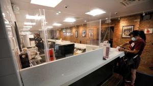 A customer orders takeout food inside one of Harlem's most iconic businesses, Sylvia's Restaurant, following the outbreak of the coronavirus disease (Covid-19) in Manhattan in New York City, New York.(Reuters Photo) A customer orders takeout food inside one of Harlem's most iconic businesses, Sylvia's Restaurant, following the outbreak of the coronavirus disease (Covid-19) in Manhattan in New York City, New York.(Reuters Photo)