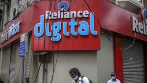 Pedestrians walk past a store of Reliance Digital Retail Ltd., a subsidiary of Reliance Industries Ltd., in Mumbai.(Bloomberg File Photo) Pedestrians walk past a store of Reliance Digital Retail Ltd., a subsidiary of Reliance Industries Ltd., in Mumbai.(Bloomberg File Photo)