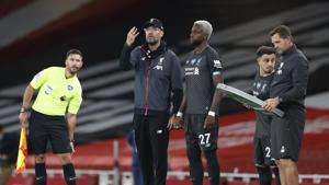 Liverpool manager Juergen Klopp and substitute Divock Origi(REUTERS) Liverpool manager Juergen Klopp and substitute Divock Origi(REUTERS)