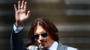 Actor Johnny Depp waves as he leaves the High Court in London.(REUTERS) Actor Johnny Depp waves as he leaves the High Court in London.(REUTERS)