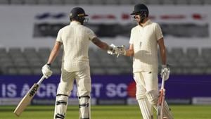 Ben Stokes, left, and Dom Sibley tap their gloves at the end of the first day of the second cricket Test match between England and West Indies at Old Trafford in Manchester, England.(AP) Ben Stokes, left, and Dom Sibley tap their gloves at the end of the first day of the second cricket Test match between England and West Indies at Old Trafford in Manchester, England.(AP)
