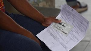 An individual holds a rapid antigen testing kit while waiting to give a sample for coronavirus test, at Dr. Hedgewar Arogya Sansthan, in New Delhi on Thursday.(Raj K Raj/HT PHOTO) An individual holds a rapid antigen testing kit while waiting to give a sample for coronavirus test, at Dr. Hedgewar Arogya Sansthan, in New Delhi on Thursday.(Raj K Raj/HT PHOTO)