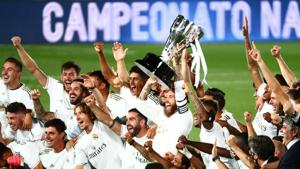 Real Madrid's Sergio Ramos and teammates celebrate with the trophy after winning La Liga.(REUTERS) Real Madrid's Sergio Ramos and teammates celebrate with the trophy after winning La Liga.(REUTERS)