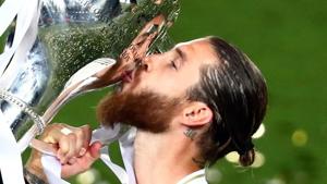 Real Madrid's Sergio Ramos celebrates with the trophy after winning La Liga, as play resumes behind closed doors following the outbreak of the coronavirus disease (COVID-19).(REUTERS) Real Madrid's Sergio Ramos celebrates with the trophy after winning La Liga, as play resumes behind closed doors following the outbreak of the coronavirus disease (COVID-19).(REUTERS)