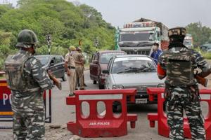 Jammu and Kashmir Police and Central Reserve Police Force (CRPF) personnel check vehicles on the Jammu-Srinagar National Highway in this file photo.(PTI Photo) Jammu and Kashmir Police and Central Reserve Police Force (CRPF) personnel check vehicles on the Jammu-Srinagar National Highway in this file photo.(PTI Photo)