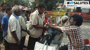 Three times a week, after winding up his fish trade for the day, Rao returns home on his Scooty to pick up food packets.(HT Photo) Three times a week, after winding up his fish trade for the day, Rao returns home on his Scooty to pick up food packets.(HT Photo)