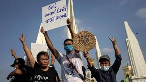 Protesters hold a sign that reads, "The longer you stay, the more devastation to the country, please resign" as they take part in an anti-government demonstration in Bangkok.(AFP) Protesters hold a sign that reads, "The longer you stay, the more devastation to the country, please resign" as they take part in an anti-government demonstration in Bangkok.(AFP)