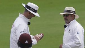 Umpire Richard Illingworth, right, watches as fellow umpire Michael Gough cleans the ball during the fourth day of the second cricket Test match between England and West Indies at Old Trafford in Manchester, England, Sunday, July 19, 2020. (AP Photo/Jon Super, Pool)(AP) Umpire Richard Illingworth, right, watches as fellow umpire Michael Gough cleans the ball during the fourth day of the second cricket Test match between England and West Indies at Old Trafford in Manchester, England, Sunday, July 19, 2020. (AP Photo/Jon Super, Pool)(AP)