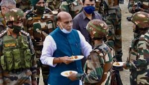 Defence Minister Rajnath Singh exchanges sweets while interacting with Indian Army personnel as he visits the forward posts near LoC in Kashmir on Saturday.(ANI Photo) Defence Minister Rajnath Singh exchanges sweets while interacting with Indian Army personnel as he visits the forward posts near LoC in Kashmir on Saturday.(ANI Photo)
