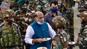 Defence Minister Rajnath Singh exchanges sweets while interacting with Indian Army personnel as he visits the forward posts near Line of Control, in Kashmir on Saturday.(ANI Photo) Defence Minister Rajnath Singh exchanges sweets while interacting with Indian Army personnel as he visits the forward posts near Line of Control, in Kashmir on Saturday.(ANI Photo)