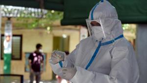 A health worker conducts a coronavirus test, from the collected swab samples, at Turkman Gate, in New Delhi.(Sonu Mehta/HT PHOTO) A health worker conducts a coronavirus test, from the collected swab samples, at Turkman Gate, in New Delhi.(Sonu Mehta/HT PHOTO)