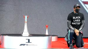 Mercedes' Lewis Hamilton kneels in support of the Black Lives Matter campaign before the race.(REUTERS) Mercedes' Lewis Hamilton kneels in support of the Black Lives Matter campaign before the race.(REUTERS)