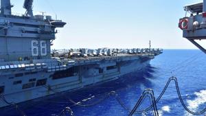 The US navy aircraft carrier USS Nimitz receives fuel from the Henry J Kaiser-class fleet replenishment oiler USNS Tippecanoe during an underway replenishment in the South China Sea, on July 7.(Reuters Photo) The US navy aircraft carrier USS Nimitz receives fuel from the Henry J Kaiser-class fleet replenishment oiler USNS Tippecanoe during an underway replenishment in the South China Sea, on July 7.(Reuters Photo)
