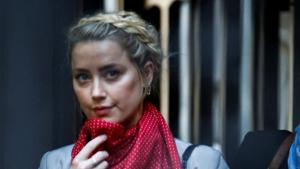 Actor Amber Heard gestures as she arrives at the High Court in London, Britain.(REUTERS) Actor Amber Heard gestures as she arrives at the High Court in London, Britain.(REUTERS)