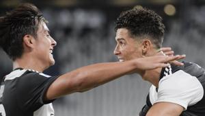 Juventus' Cristiano Ronaldo, right, celebrates with teammate Paulo Dybala after scoring a goal during the Italian Serie A soccer match between Juventus and Lazio at the Allianz stadium in Turin, Italy, Monday, July 20, 2020. (Marco Alpozzi/LaPresse via AP)(AP) Juventus' Cristiano Ronaldo, right, celebrates with teammate Paulo Dybala after scoring a goal during the Italian Serie A soccer match between Juventus and Lazio at the Allianz stadium in Turin, Italy, Monday, July 20, 2020. (Marco Alpozzi/LaPresse via AP)(AP)