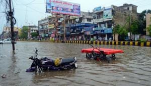 Vehicles are seen submerged on a waterlogged road after heavy rain in Haridwar on Tuesday.(ANI Photo) Vehicles are seen submerged on a waterlogged road after heavy rain in Haridwar on Tuesday.(ANI Photo)