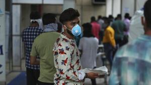 A man wearing a face mask waits to consult a doctor at a Covid-19 screening centre at a government-run hospital in Jammu.(AP File Photo) A man wearing a face mask waits to consult a doctor at a Covid-19 screening centre at a government-run hospital in Jammu.(AP File Photo)