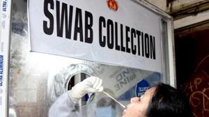 A healthcare worker collects swab sample from a woman for Covid-19 testing in Guwahati.(ANI) A healthcare worker collects swab sample from a woman for Covid-19 testing in Guwahati.(ANI)