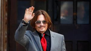 Actor Johnny Depp waves as he leaves the High Court in London.(REUTERS) Actor Johnny Depp waves as he leaves the High Court in London.(REUTERS)
