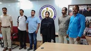 Kerala gold smuggling case accused Swapna Suresh and Sandeep Nair (both in the middle) after they were arrested by the National Investigation Agency in Bengaluru earlier.(PTI PHOTO.) Kerala gold smuggling case accused Swapna Suresh and Sandeep Nair (both in the middle) after they were arrested by the National Investigation Agency in Bengaluru earlier.(PTI PHOTO.)
