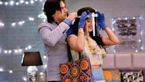 A still from TV show Yeh Rishta Kya Kehlata Hai, with the characters wearing face shields and gloves. A still from TV show Yeh Rishta Kya Kehlata Hai, with the characters wearing face shields and gloves.