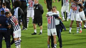 West Bromwich Albion's Jake Livermore and manager Slaven Bilic celebrate promotion to the Premier League after the match.(Action Images via Reuters) West Bromwich Albion's Jake Livermore and manager Slaven Bilic celebrate promotion to the Premier League after the match.(Action Images via Reuters)