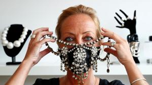 Belgian jewellery designer Olivia Hainaut poses wearing a protective mask decorated with gems in her workshop amid the coronavirus disease (COVID-19) outbreak in Brussels, Belgium July 22, 2020.(REUTERS) Belgian jewellery designer Olivia Hainaut poses wearing a protective mask decorated with gems in her workshop amid the coronavirus disease (COVID-19) outbreak in Brussels, Belgium July 22, 2020.(REUTERS)