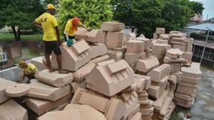 Workers clean stone blocks to be used in construction of the Ram Temple, at a workshop in Ayodhya. (PTI photo) Workers clean stone blocks to be used in construction of the Ram Temple, at a workshop in Ayodhya. (PTI photo)