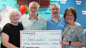 Tom Cook and Joe Feene and their families collecting the prize.(YouTube/Wisconsin Lottery) Tom Cook and Joe Feene and their families collecting the prize.(YouTube/Wisconsin Lottery)